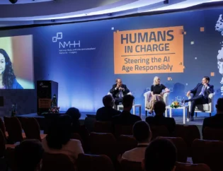 Participants of the 4th panel discussion of the Humans in Charge AI conference held on 2 October 2023 in Budapest, Hungary. Form the left: Andrea Halmos (online, on the screen), Kristel Kriisa, Gianluca Misuraca, George Tilesch and moderator Krisztina Bombera