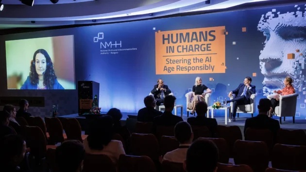Participants of the 4th panel discussion of the Humans in Charge AI conference held on 2 October 2023 in Budapest, Hungary. Form the left: Andrea Halmos (online, on the screen), Kristel Kriisa, Gianluca Misuraca, George Tilesch and moderator Krisztina Bombera