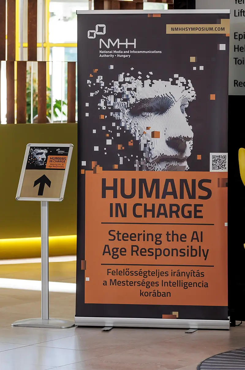 The banner of the Humans in Charge conference in the reception hall.